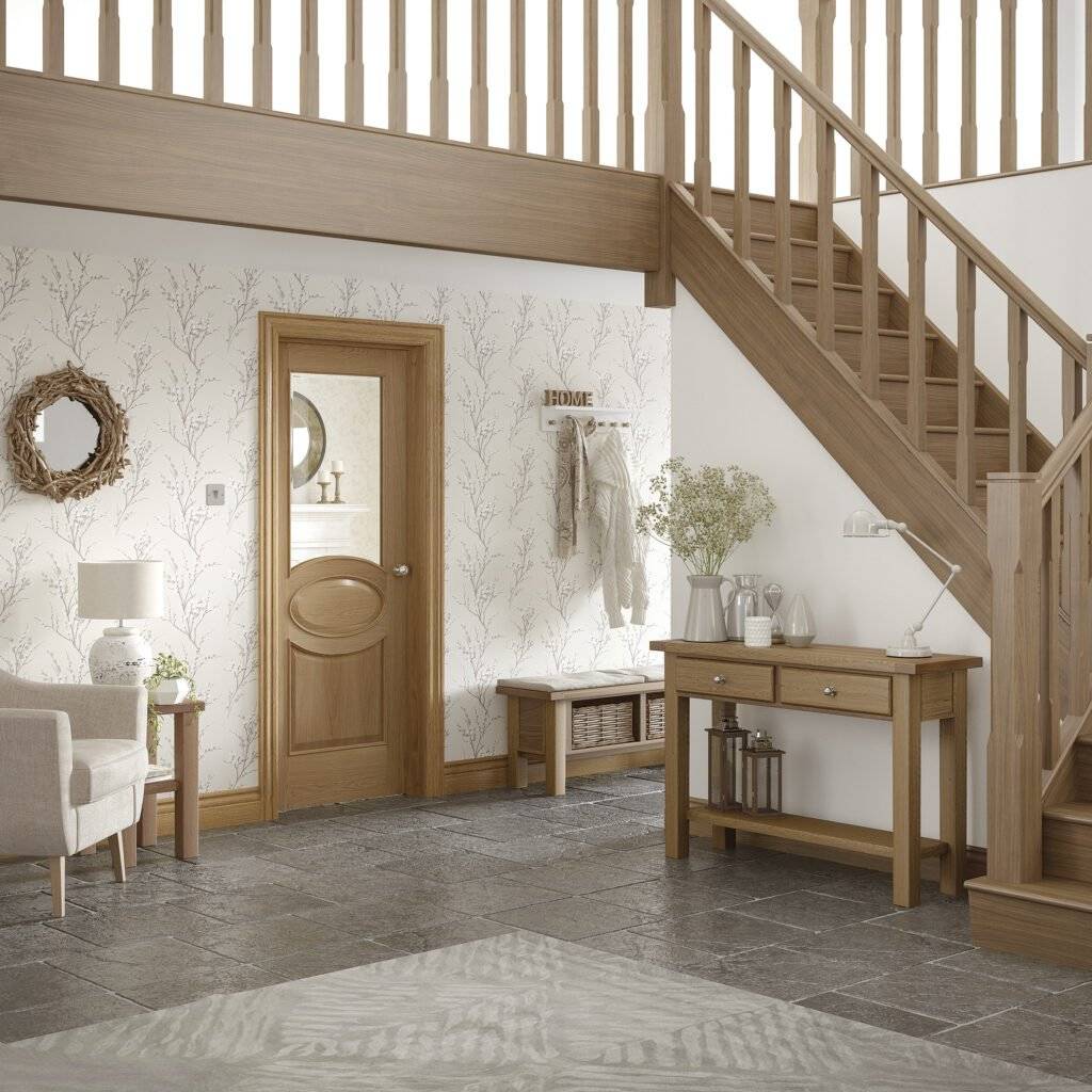 Staircase with wooden doors and furniture in a home interior setting