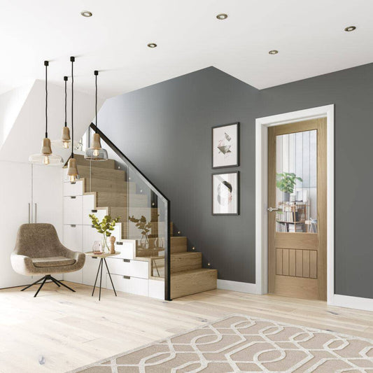 Modern interior design of a living room with gray walls, wooden staircase, and decorative elements.