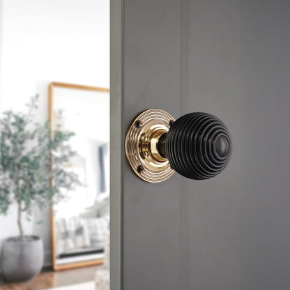 Ebony Beehive Rim/Mortice Door Knob Aged Brass