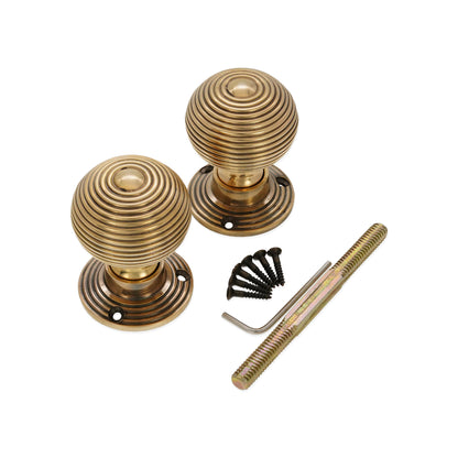 Ribbed Rim/Mortice Door Knob Aged Brass